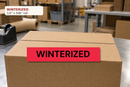 WINTERIZED custom printed tape applied to a shipping carton in a packing context