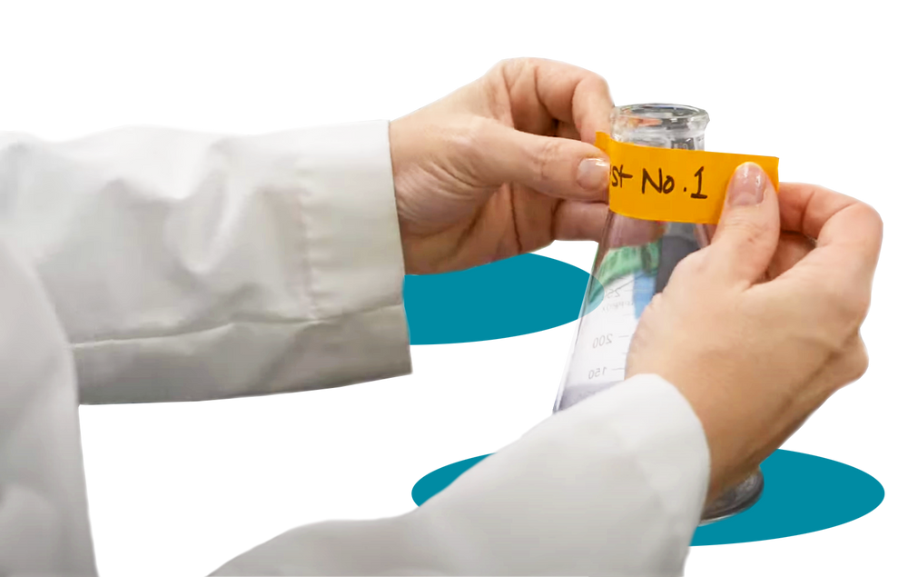 Laboratory technician labeling a vial