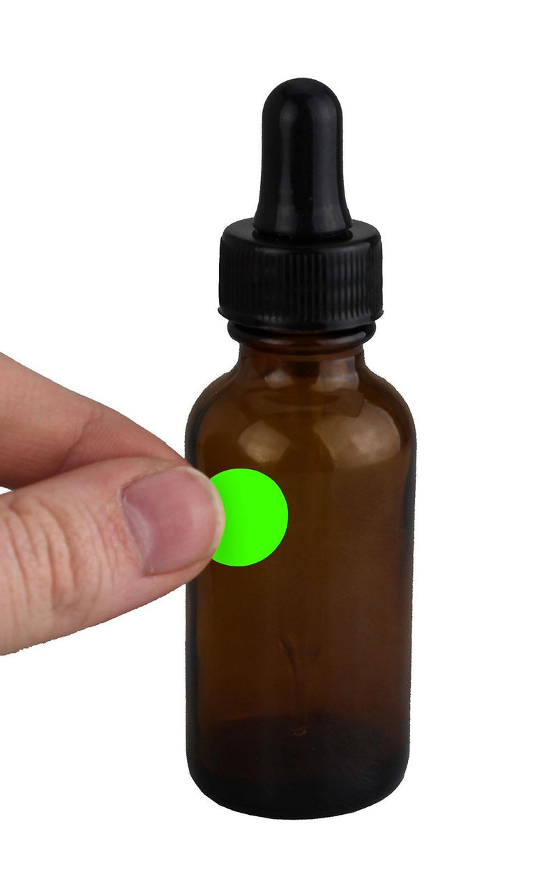 A 1/2 inch fluorescent green dot on an amber dropper bottle